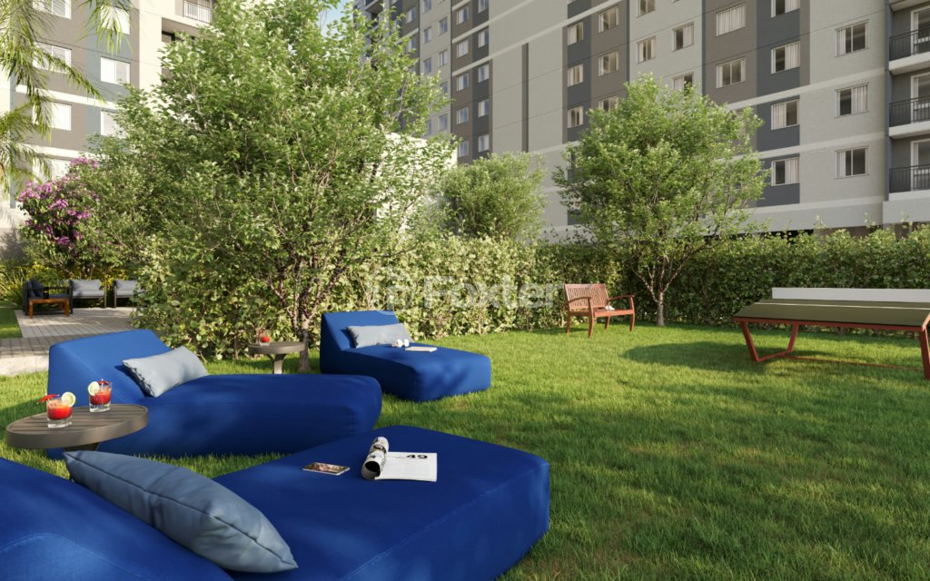 area-de-lazer-com-sofas-e-gramado